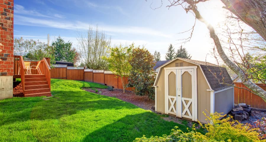 Fenced backyard with storage shed in Detroit